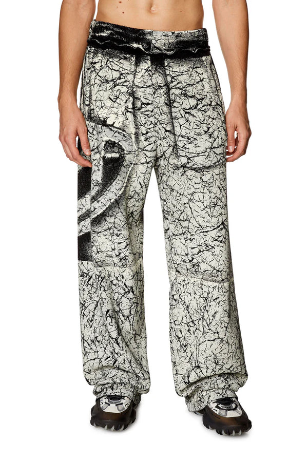 Track pants with cracked coating