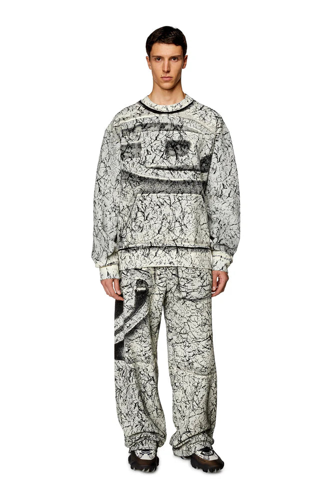 Track pants with cracked coating
